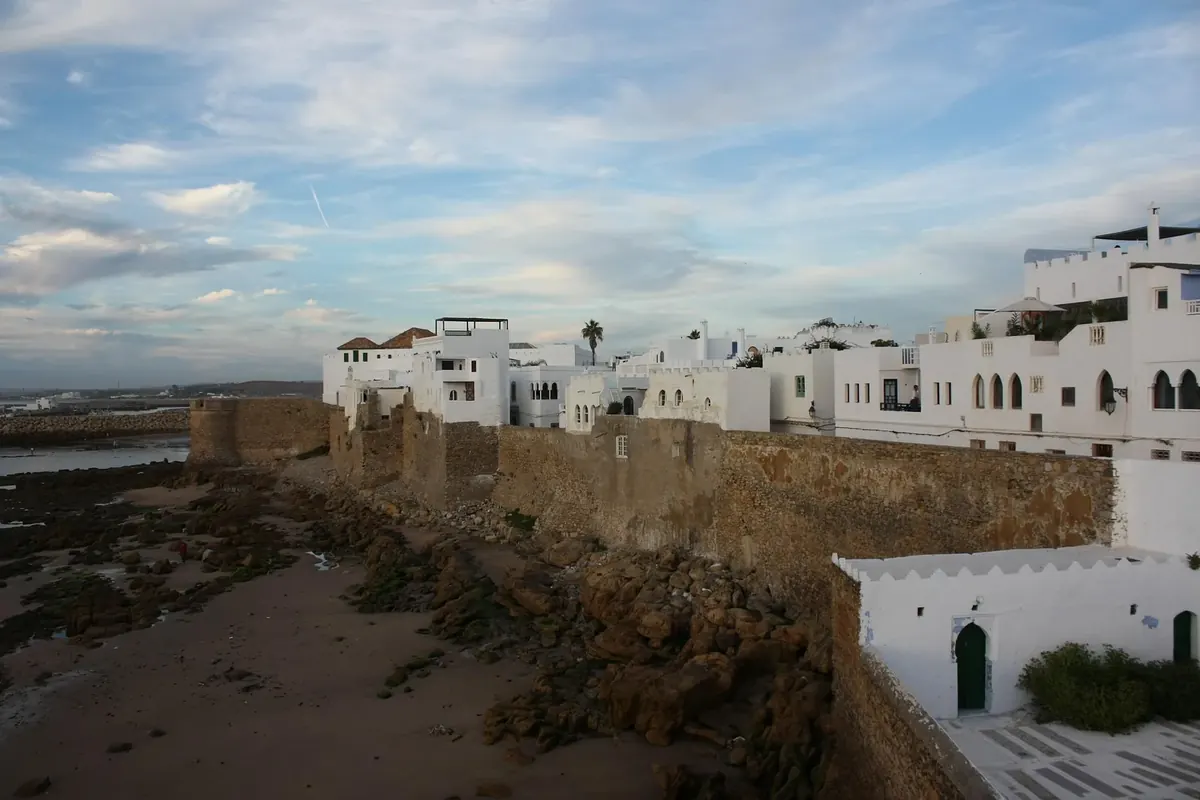 Whitewashed buildings and narrow lanes in Asilah’s medina, Morocco.
