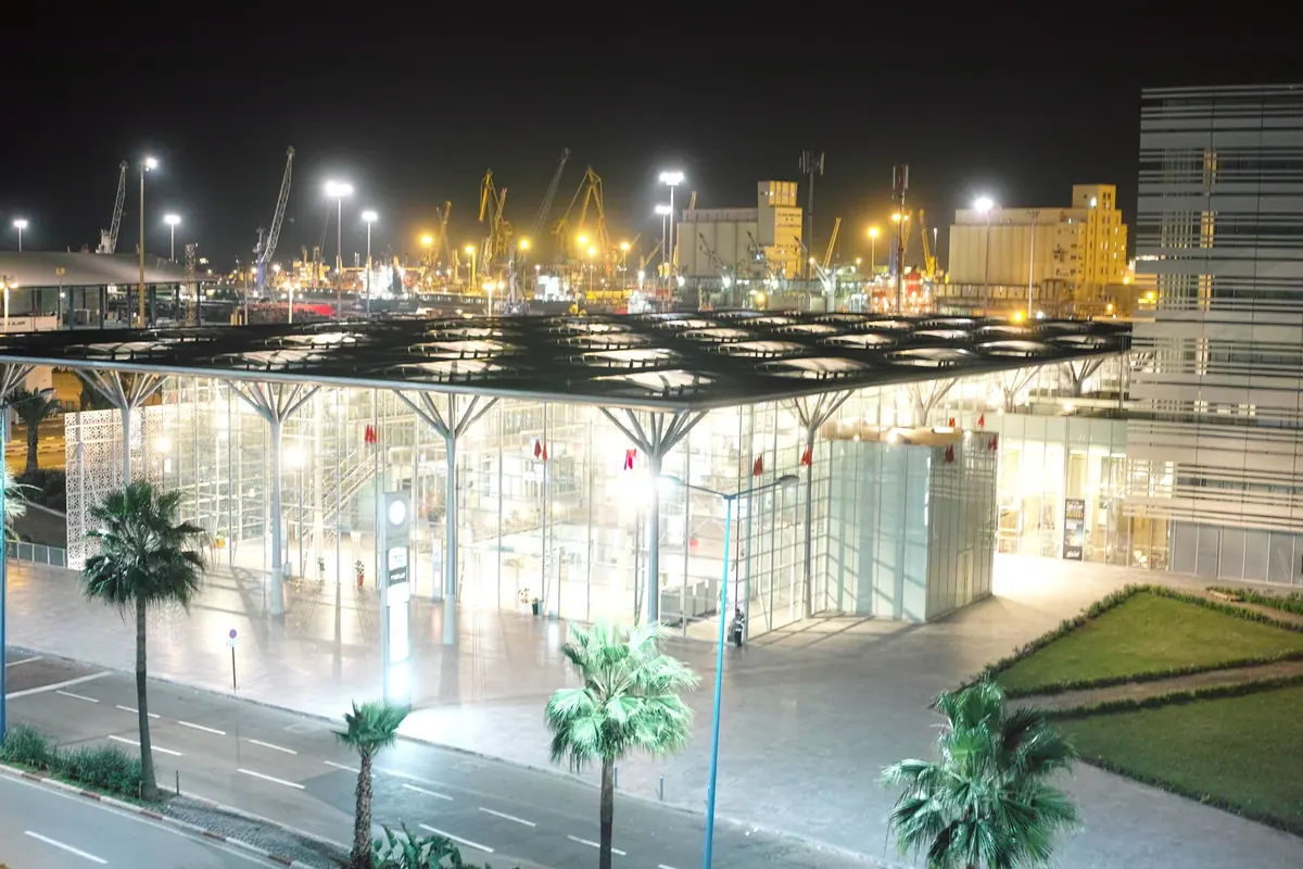 Casablanca Train Station at night, with the illuminated station entrance and platforms.