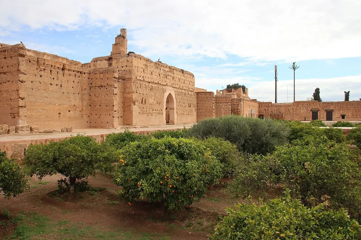 Wide view across the surviving ochre walls and garden of El Badi Palace in Marrakesh.