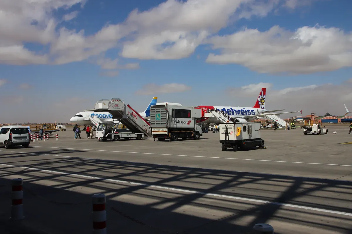 Aircraft parked beside the terminal at Marrakech–Ménara Airport.