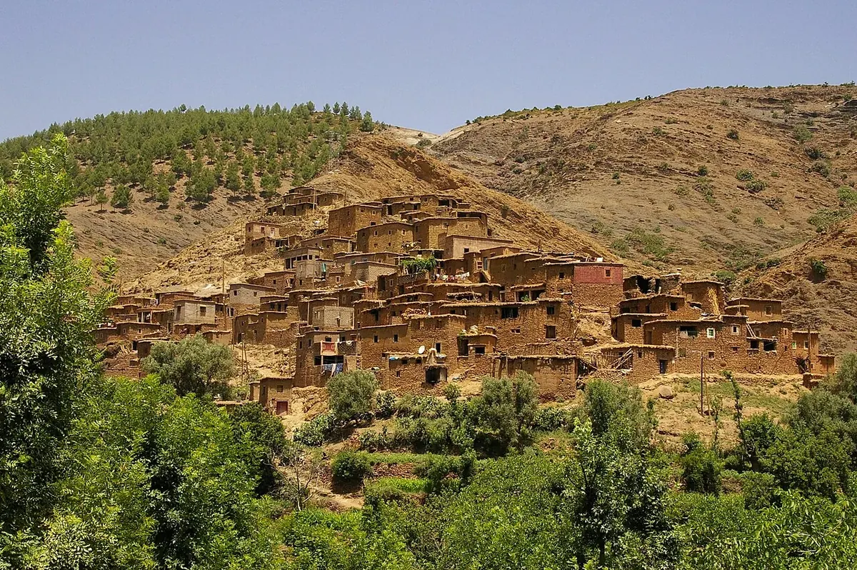 A village set among green slopes in Morocco’s Ourika Valley in the High Atlas.