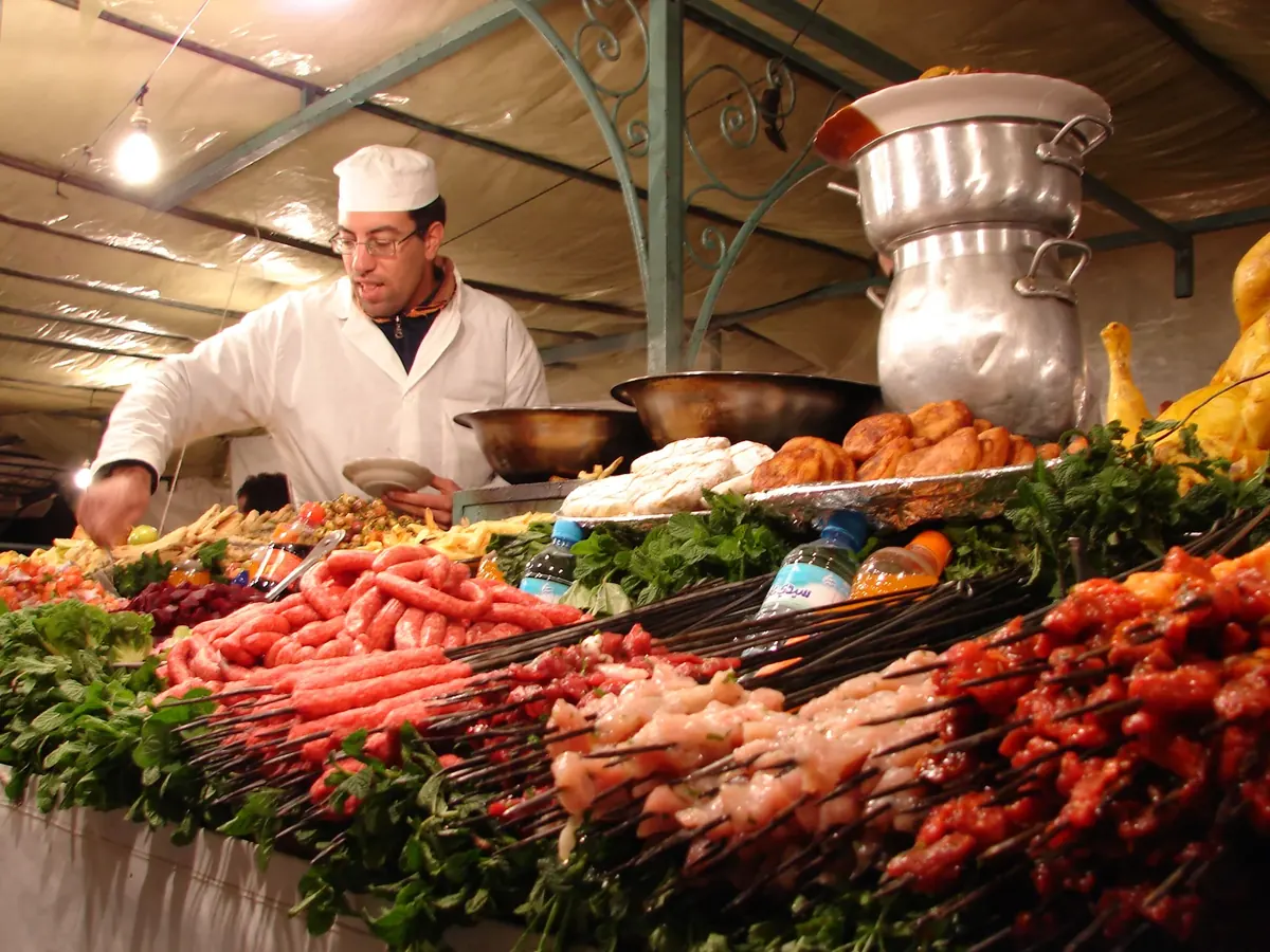 A food stall serving customers in Jemaa el-Fna square, Marrakech.
