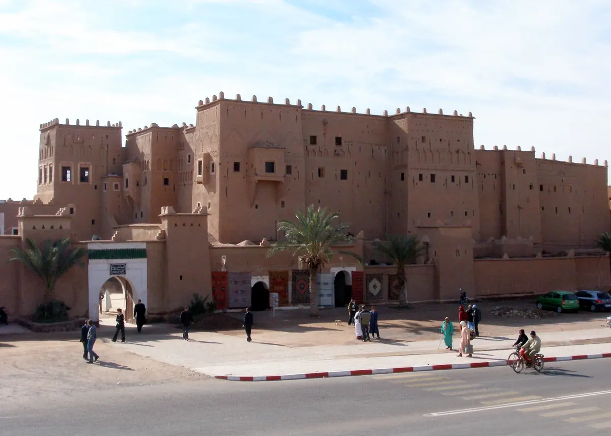 Taourirt Kasbah in Ouarzazate, seen across the street in daylight.