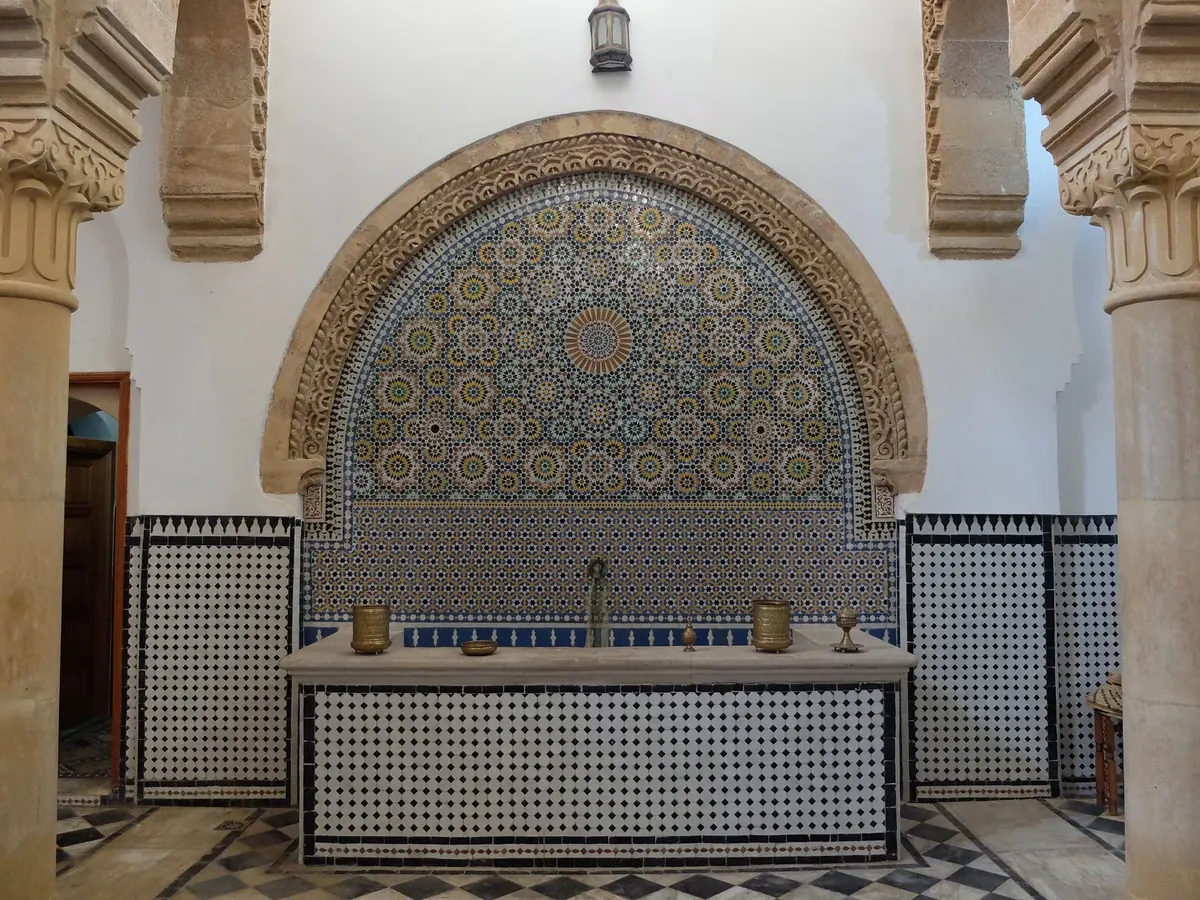 Zellij wall fountain in the main reception hall of Hammam Saffarin in Fes, Morocco.