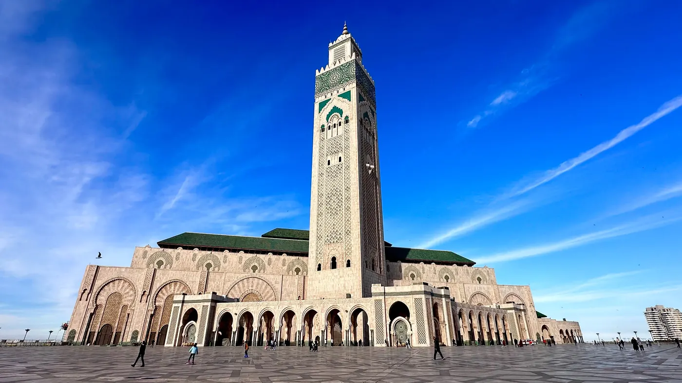 Hassan II Mosque facade and minaret on the open plaza in Casablanca.