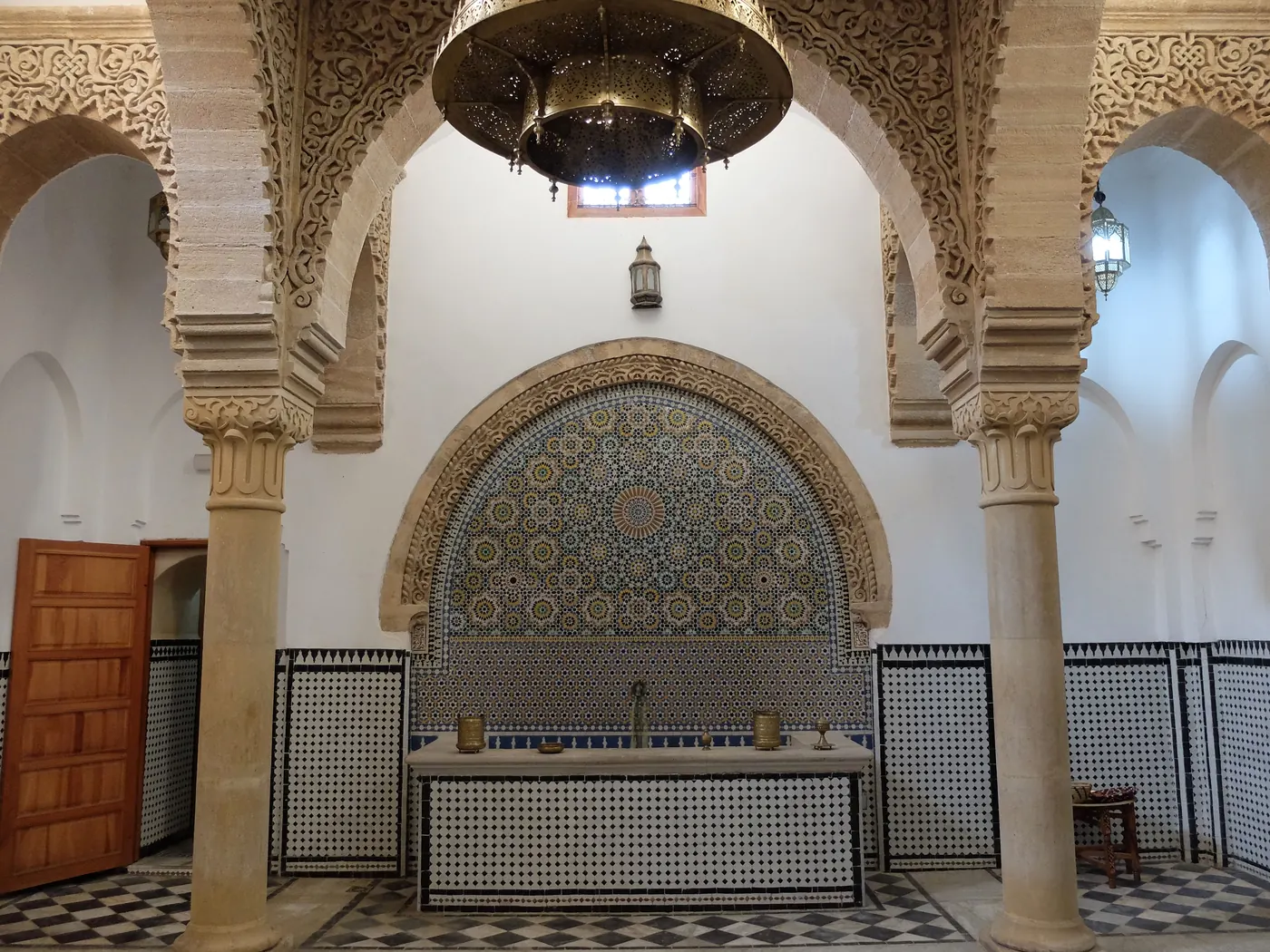 Arched tiled reception hall at Hammam Saffarin in Fes, Morocco