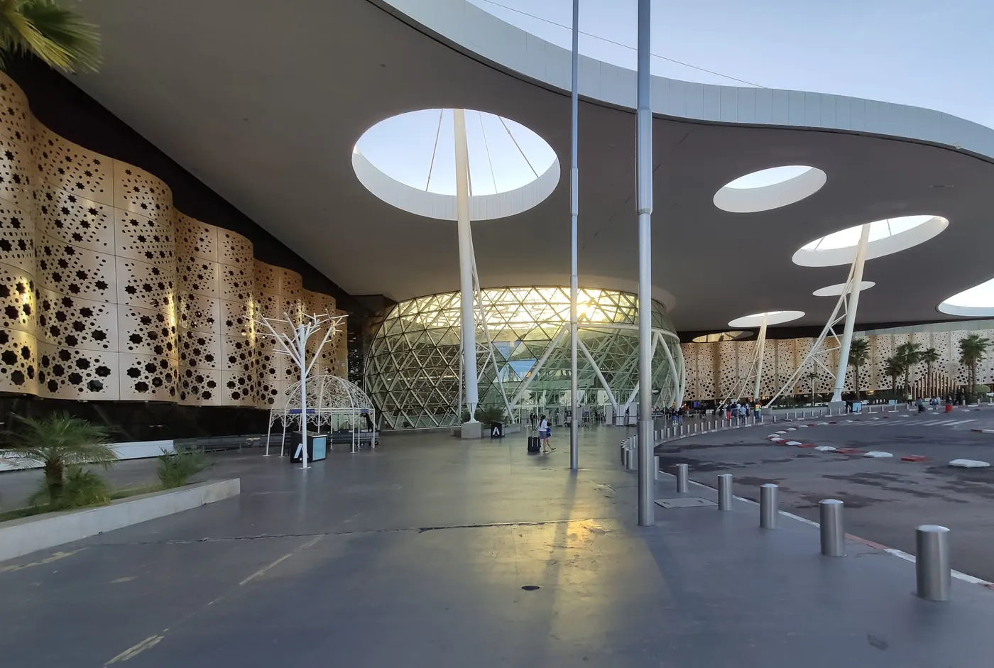 Entrance canopy and patterned facade of Marrakech Menara Airport.
