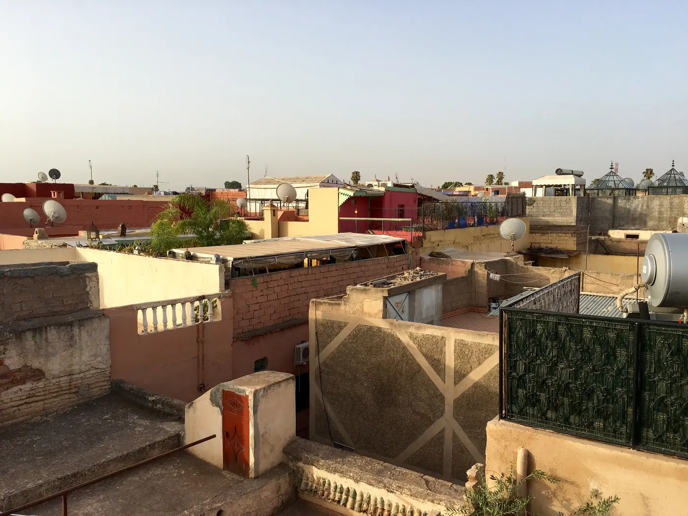 A daylight view across low-rise rooftops in the Medina of Marrakech