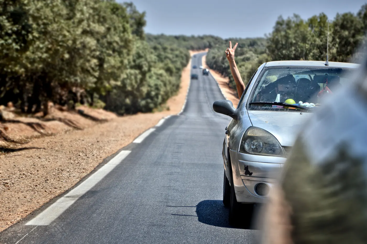 Car travelling on a road in Ifrane, Morocco, viewed from another vehicle