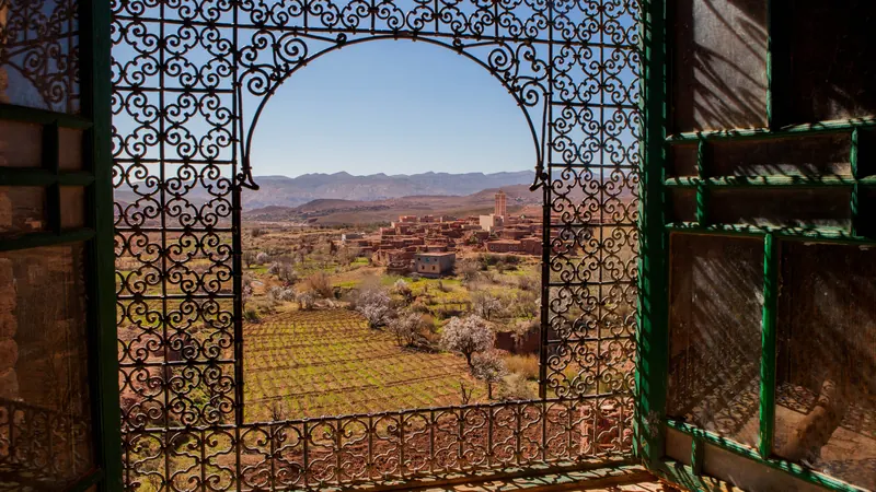 South-west view through a window grille at Telouet Kasbah in the High Atlas, Morocco.