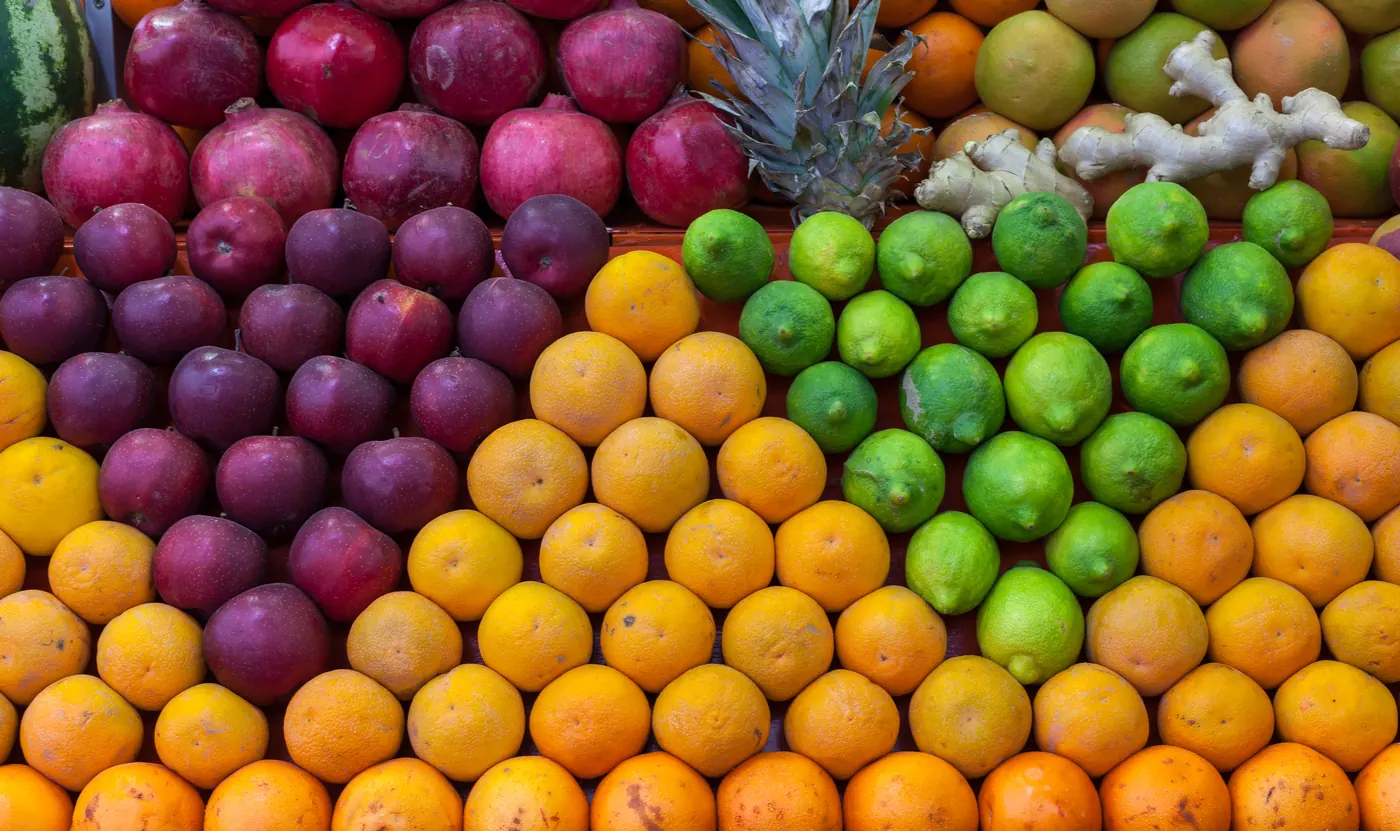 Rows of pomegranates, oranges, limes and other fruit at a Marrakech market.