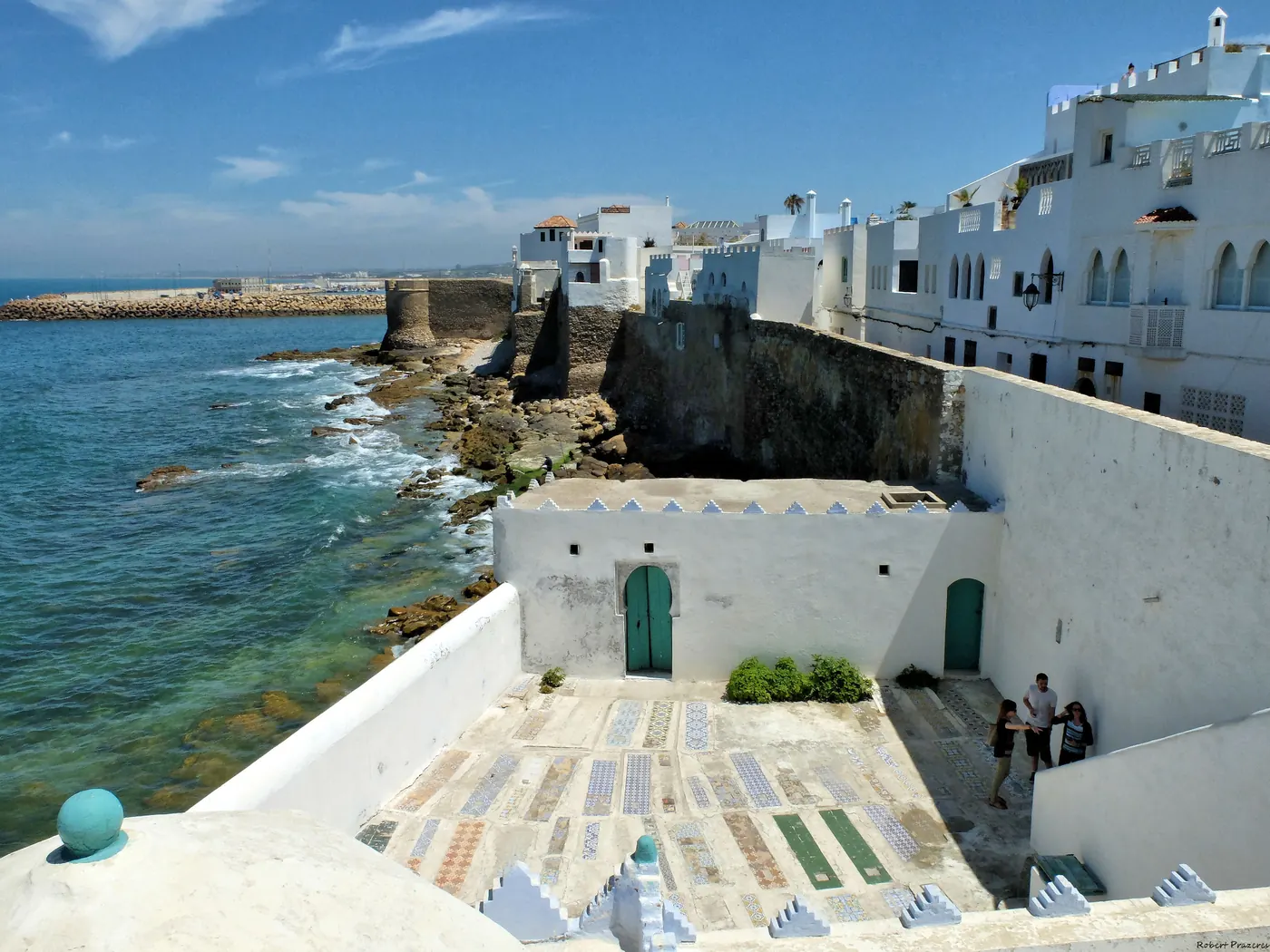 Asilah Medina sea walls and white buildings beside the Atlantic coast.