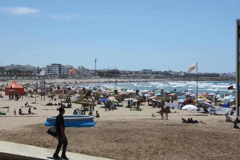 A busy sandy beach in Asilah, Morocco, photographed in 2008.