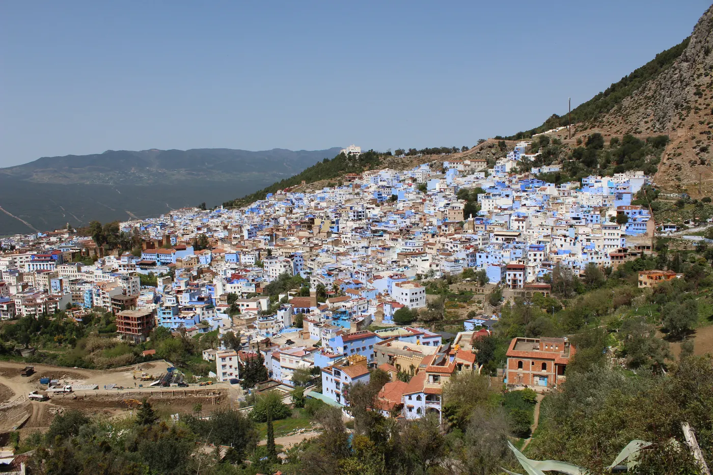 Hillside view across the blue and white buildings of Chefchaouen, Morocco