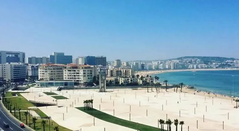 Tangier's Corniche and central beach beside the Bay of Tangier, viewed from above.